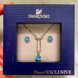 Swarovski brand new- never worn necklace and earring set. Light blue color.